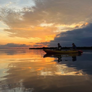 a sunset over a body of water