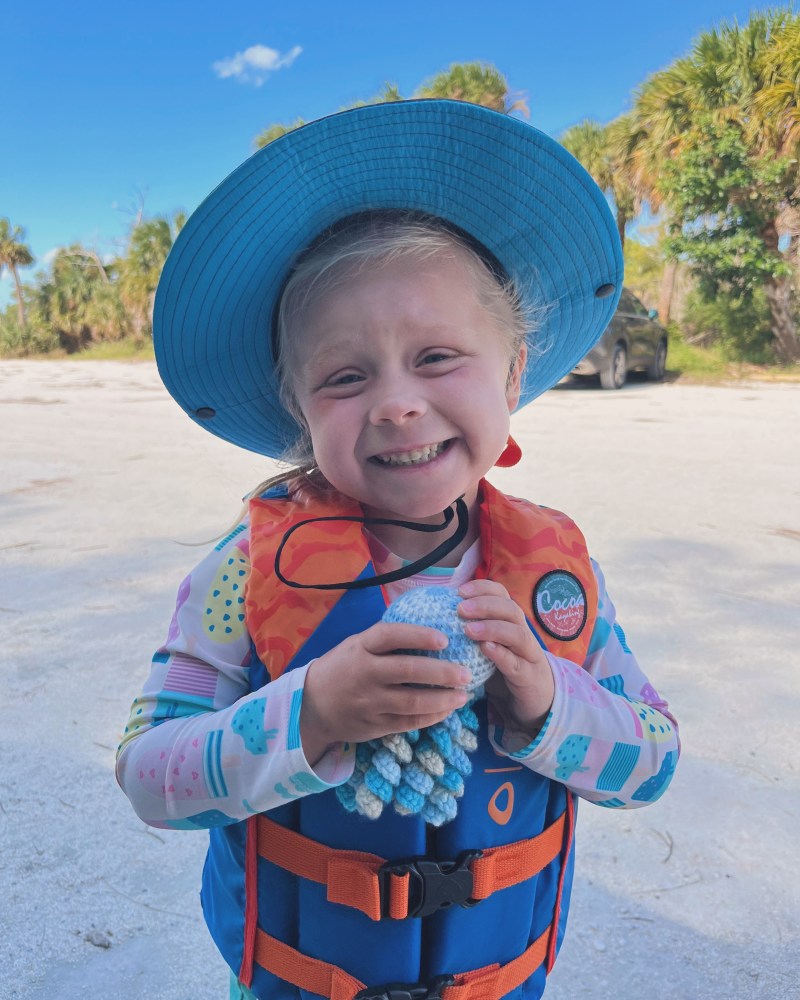 a little boy wearing a blue hat