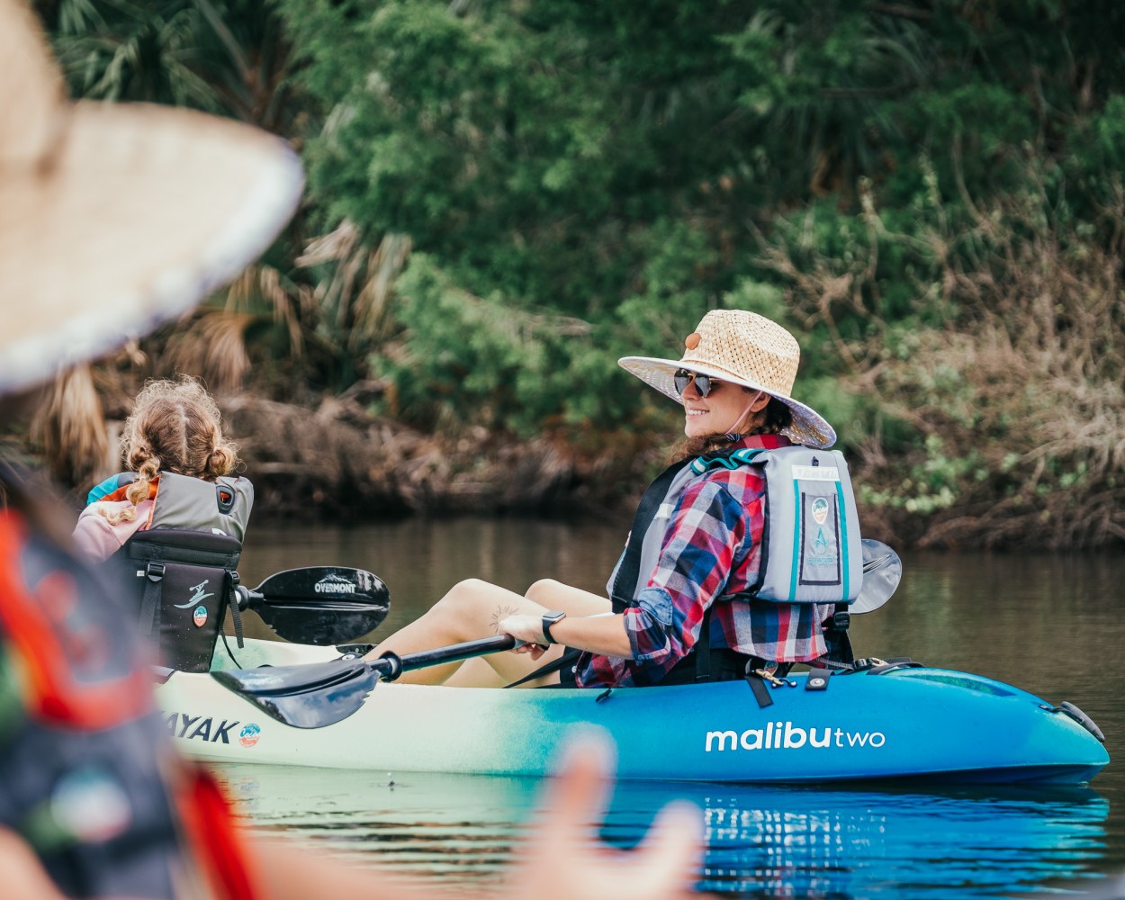 a group of people riding on the back of a boat